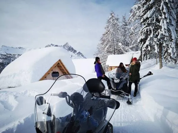 Escursione in motoslitta con cena in rifugio a Sauris