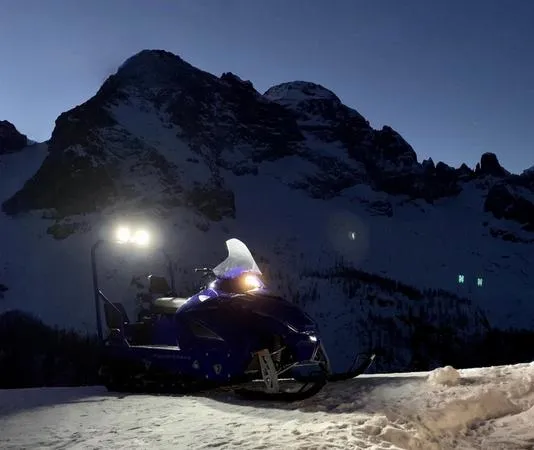 Cena in rifugio con trasporto in motoslitta in Val di Zoldo