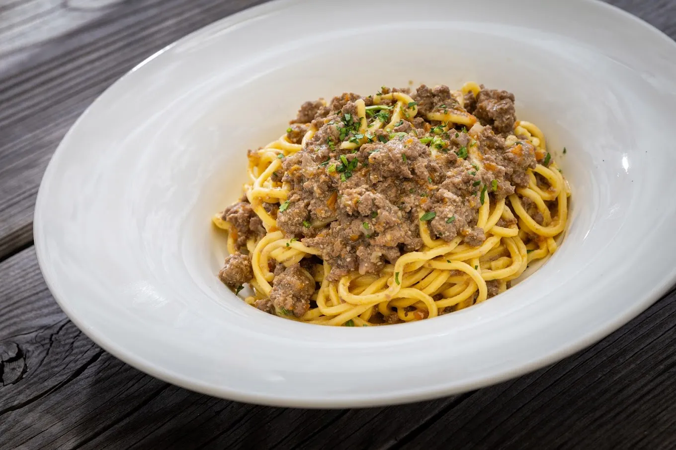 Cena in baita con trasporto in motoslitta in Val Comelico